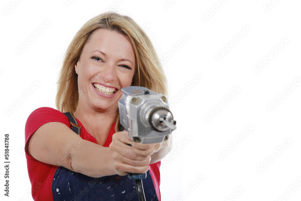 Fototapeta premium Glückliche Frau mit Bohrmaschine - woman with hand drill