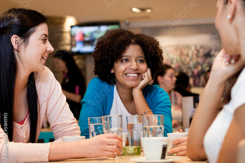 teenagers girls in cafe
