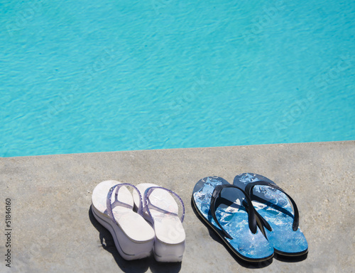 Flip flops by swimming pool