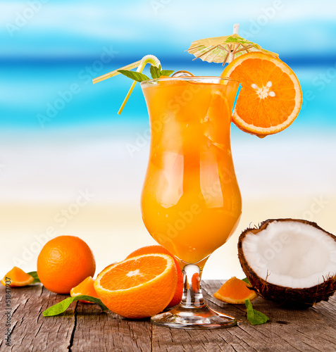 Summer drink with blur beach on background 
