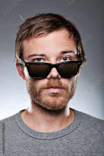 Caucasian Man Looking Over His Sunglasses