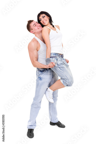 young fitness couple wearing jeans in the studio