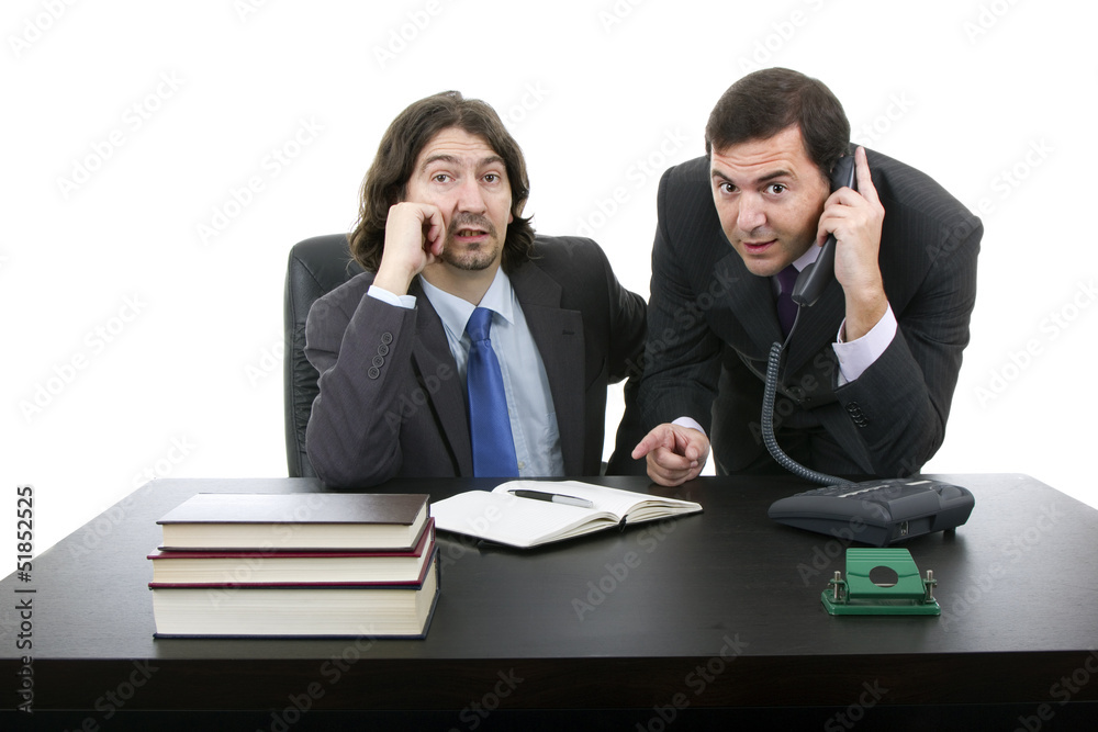 Two businessman sitting at the desk, Isolated on white Two businessman sitting at the desk, Isolated on white
