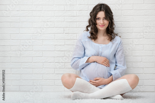 Portrait of the young pregnant woman