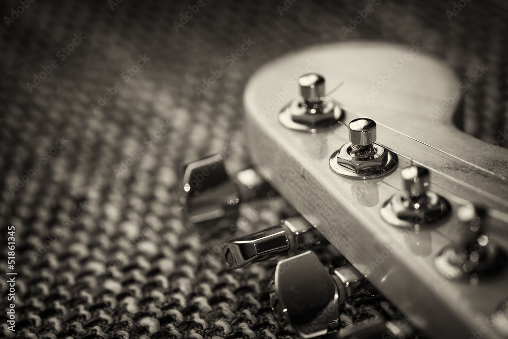 Electrical guitar headstock closeup. Sepia effect with vignette Electrical guitar headstock closeup. Sepia effect with vignette