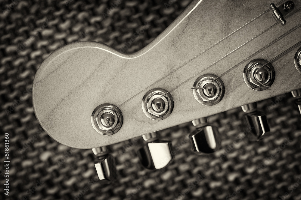 Electrical guitar headstock closeup. Sepia effect with vignette Electrical guitar headstock closeup. Sepia effect with vignette