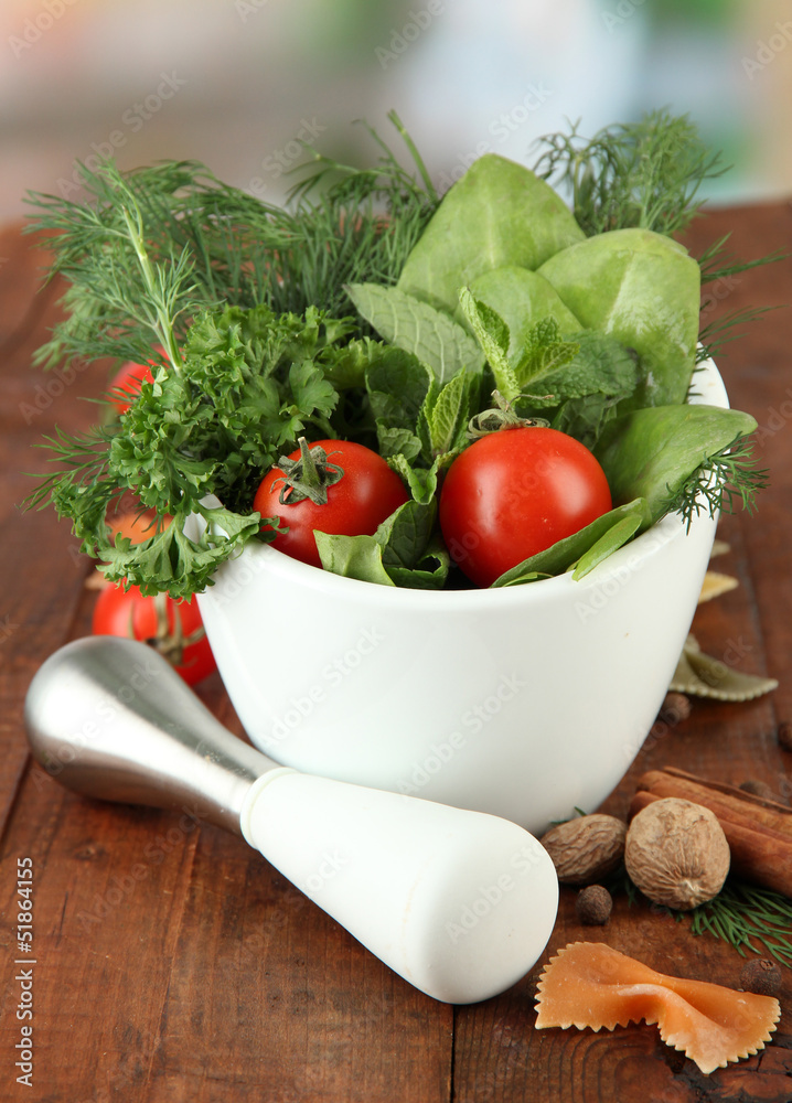 Herbs and spices in ceramic mortar,