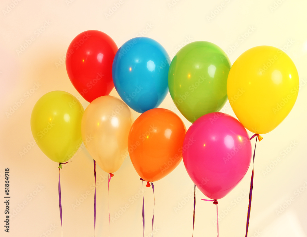 Many bright balloons on orange background Many bright balloons on orange background