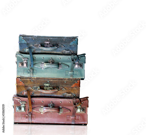Vintage old travel bags isolated on white background