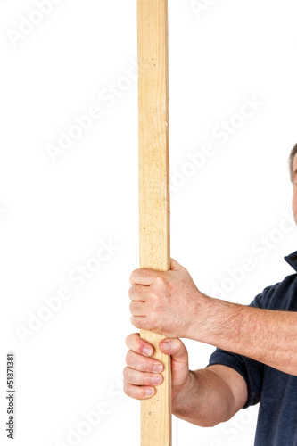 Hand holding wooden slat