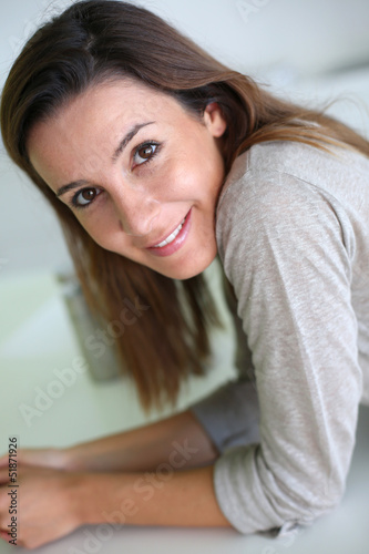 Portrait of smiling young woman © goodluz