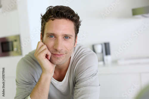 Portrait of handsome man looking at camera