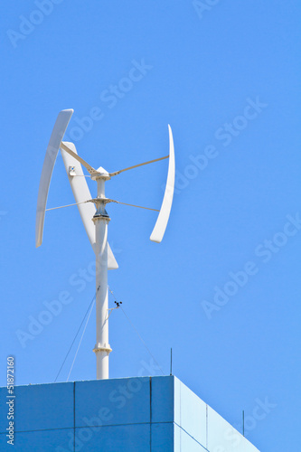 Vertical axis wind turbine on the top of building