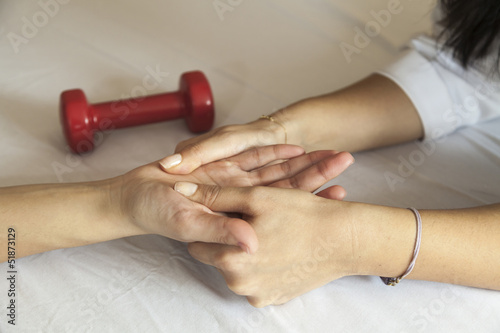 Physical therapist giving a hand massage