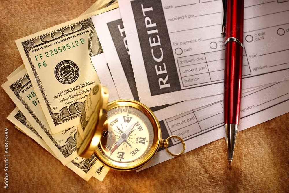 Blank receipt, money, compass and pen Blank receipt, money, compass and pen