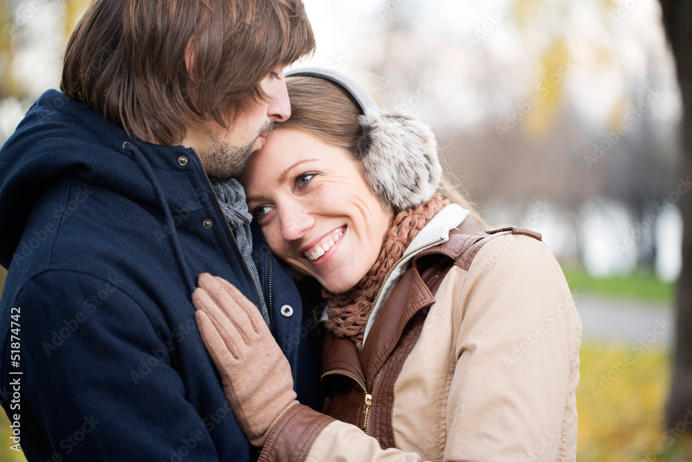 Young attractive couple together outdoors