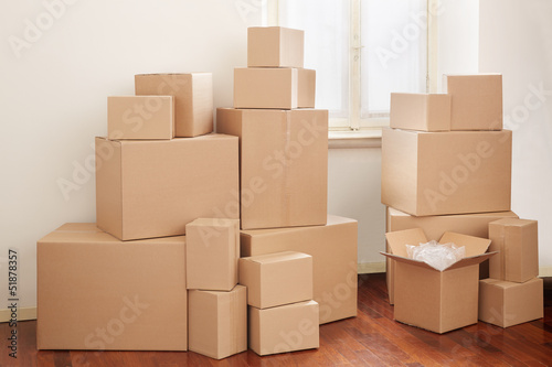 Cardboard boxes in apartment, moving day © andersphoto