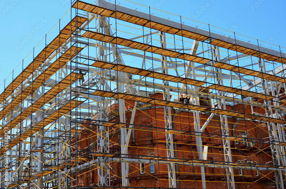 Reconstruction of a brick building against Reconstruction of a brick building against