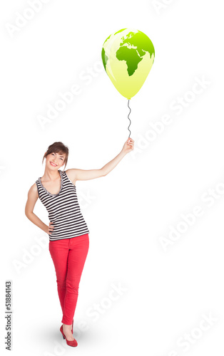 Happy lady holding a green globe balloon © ra2 studio