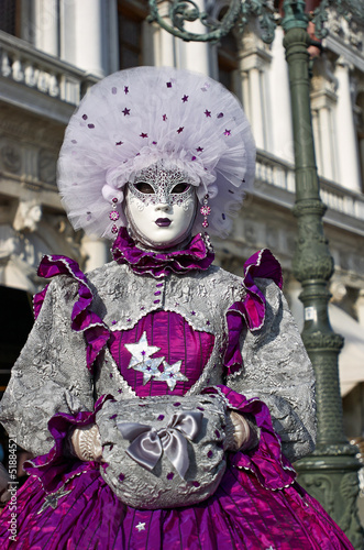 Venetian costume attends Carnival of Venice.