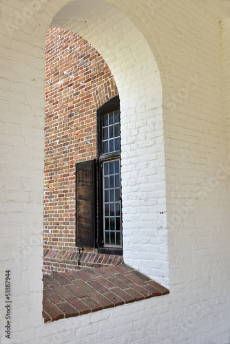Fototapeta Naklejka Na Ścianę i Meble -  Arched windows in reconstructed colonial American building