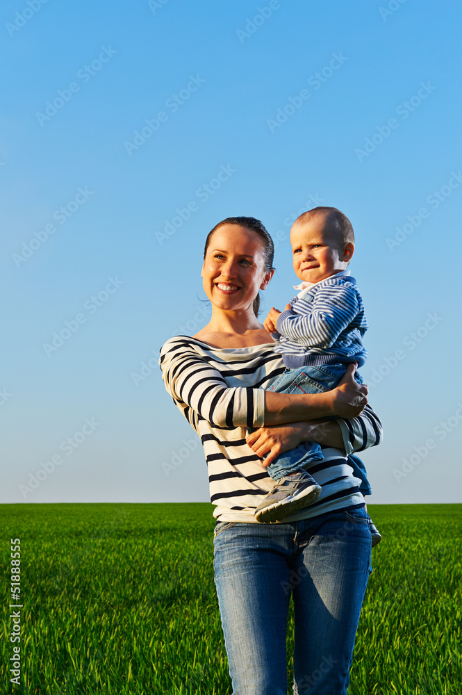 happy and smiley mother with her little son happy and smiley mother with her little son