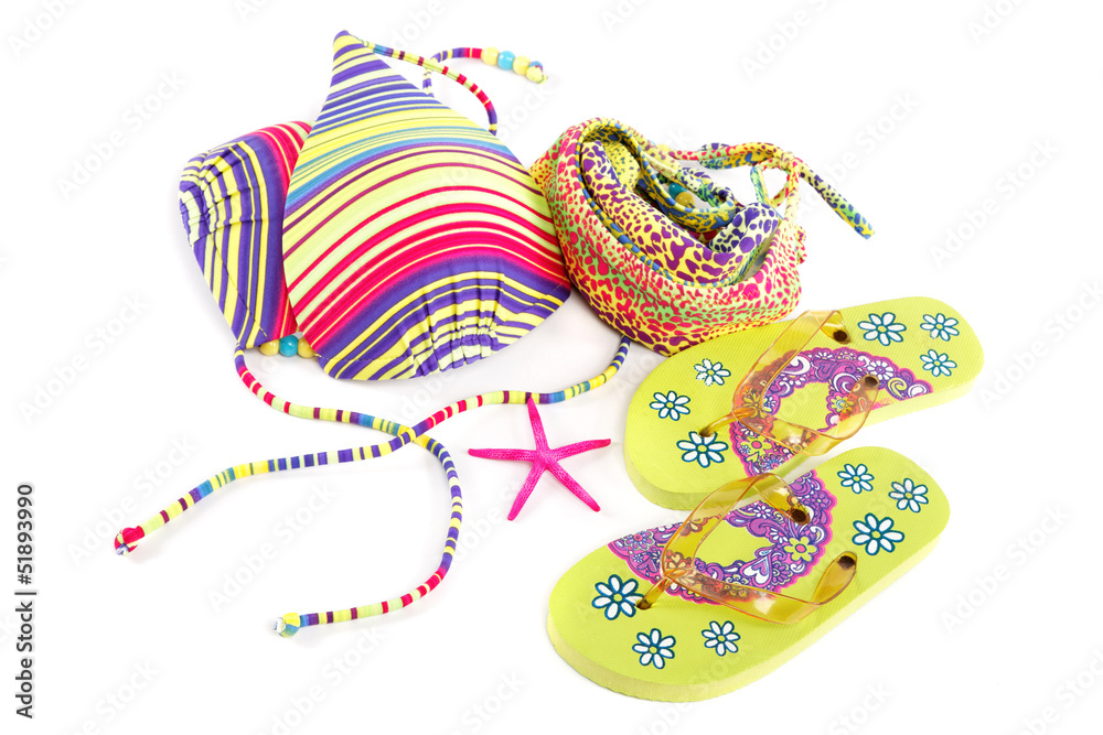 Fototapeta premium Women's swimsuit and flip-flops isolated on white background.