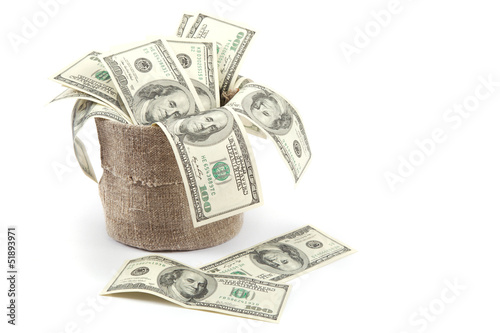 Hundred dollar bills in a canvas sack isolated on white backgrou photo