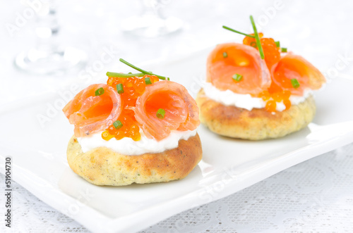 potato bun with salted salmon, red caviar and chives, horizontal