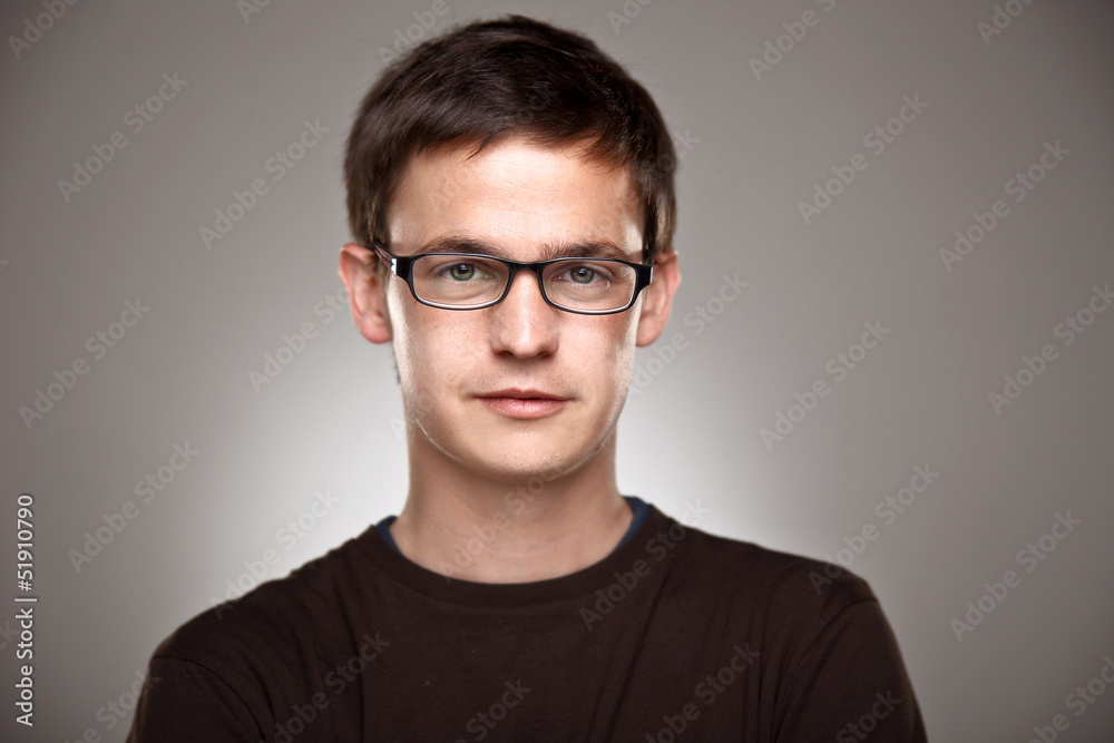 Portrait of a normal boy on a grey background Portrait of a normal boy on a grey background