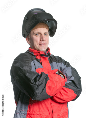 Portrait of man in working clothes and a welder mask
