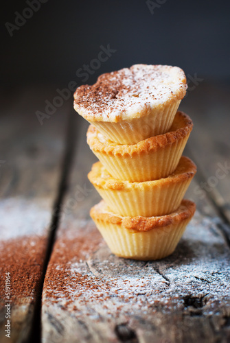 Tower from tartlets on the wooden background photo