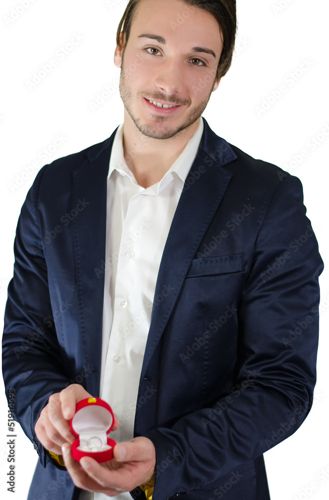 Young man holding engagement ring, isolated on white Young man holding engagement ring, isolated on white