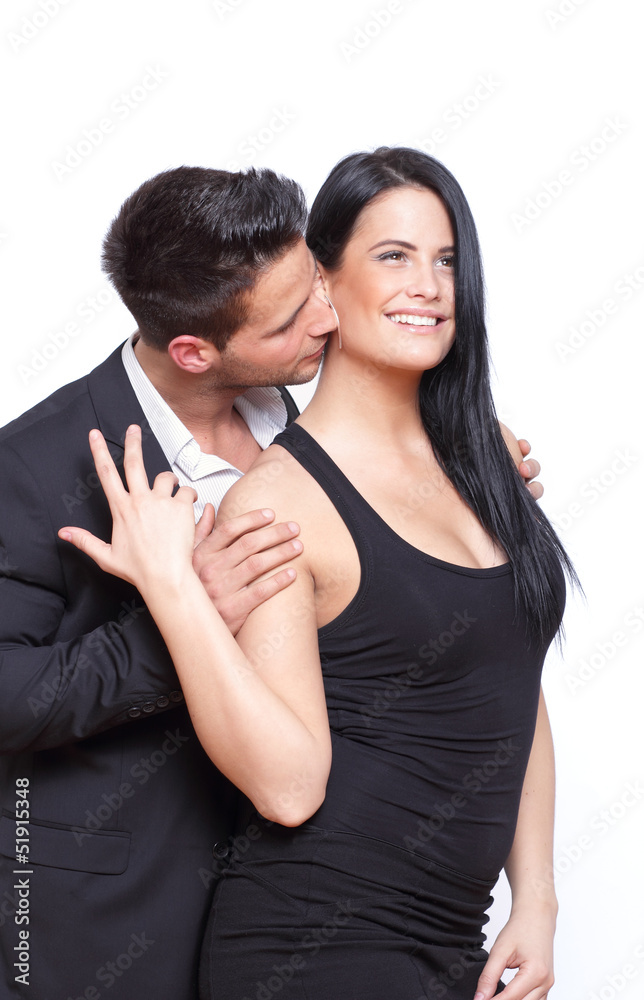 Happy lady kissed by a man in suite