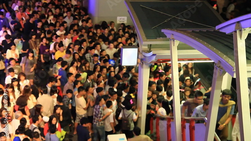 crowd of people walking to subway