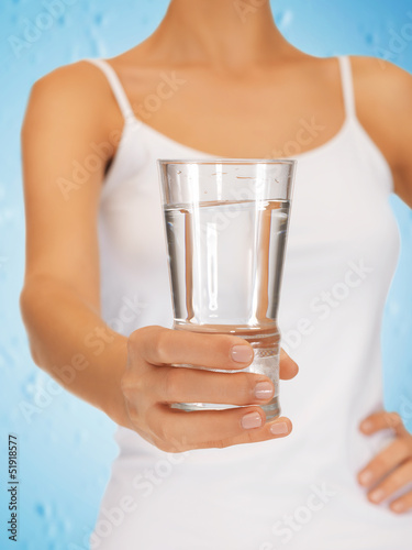 woman hands holding glass of water