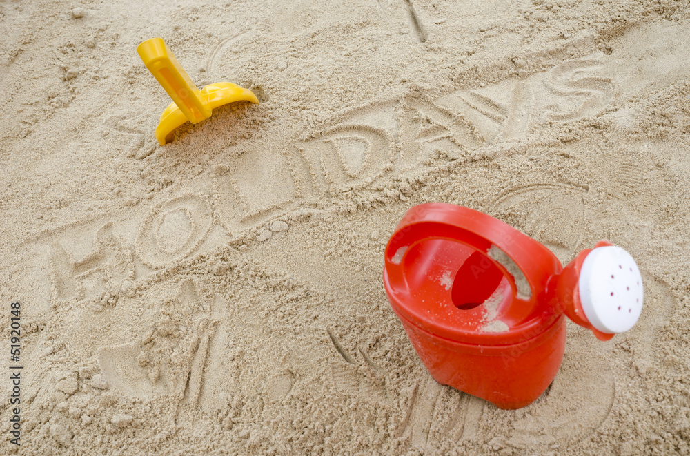 Wor holidays in sand with beach toys Wor holidays in sand with beach toys
