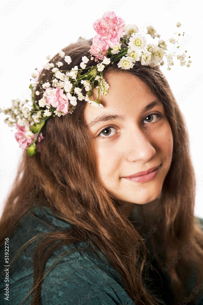 Portrait of the young girl with a wreath on the head