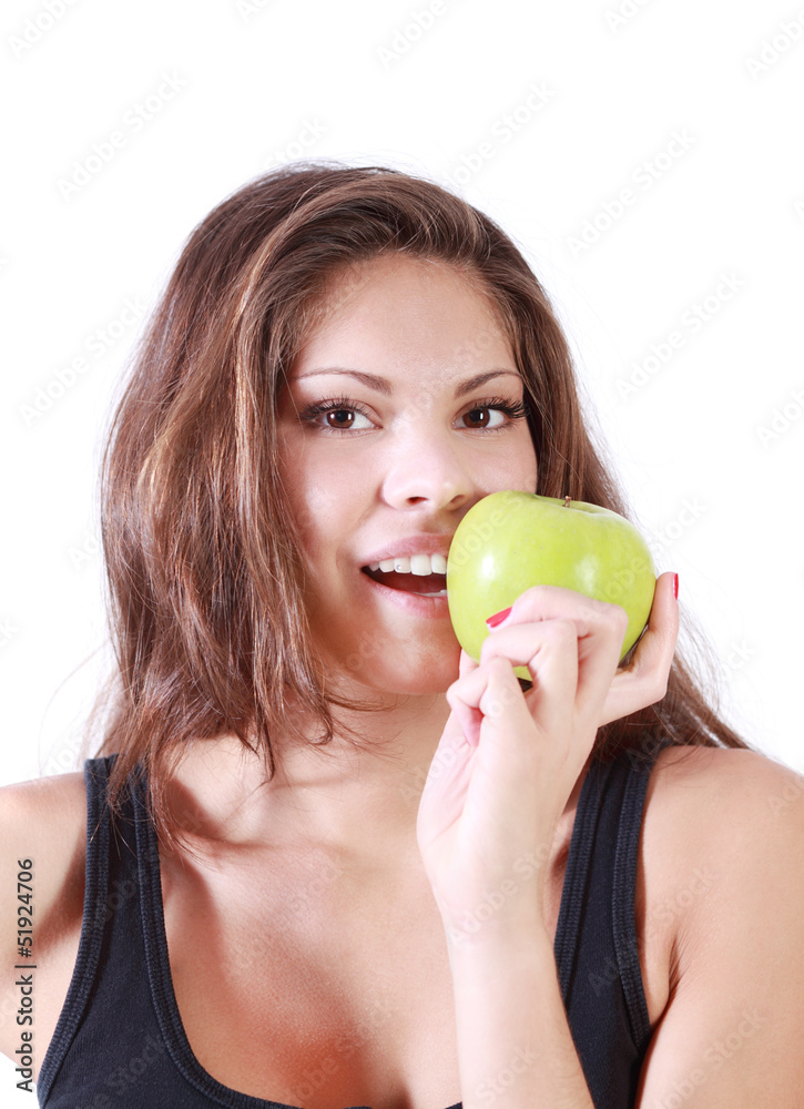 Beautiful smiling girl bites fresh green apple isolated on white Beautiful smiling girl bites fresh green apple isolated on white