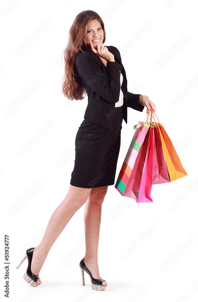 Smiling woman holds bags with purchases isolated on white Smiling woman holds bags with purchases isolated on white