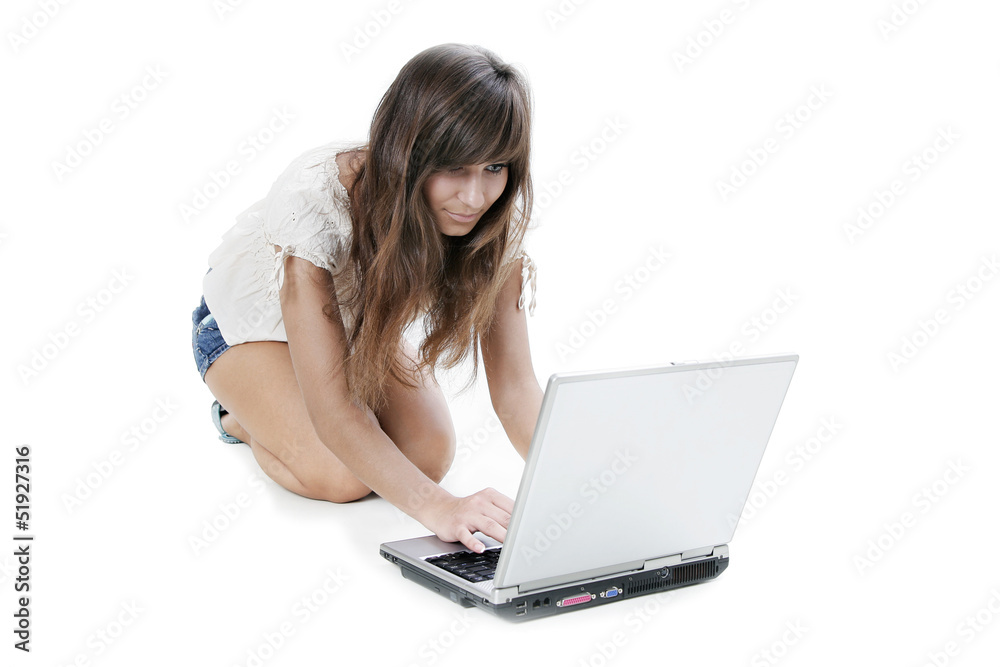 Young woman working with laptop on white background Young woman working with laptop on white background