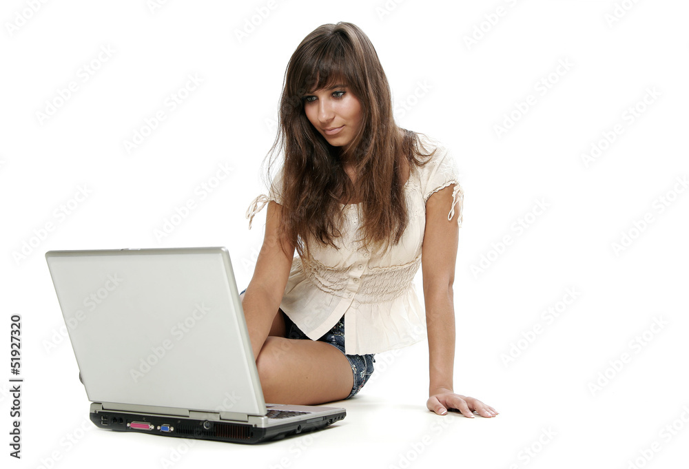 Young woman working with laptop on white background Young woman working with laptop on white background
