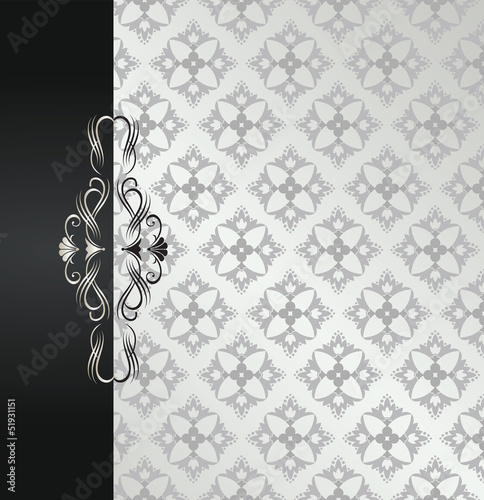 Black and silver floral book cover with scrolls