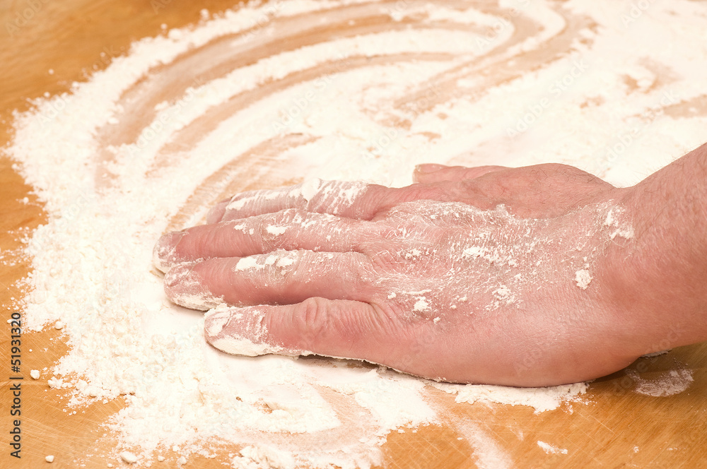 Fototapeta premium Hand and flour