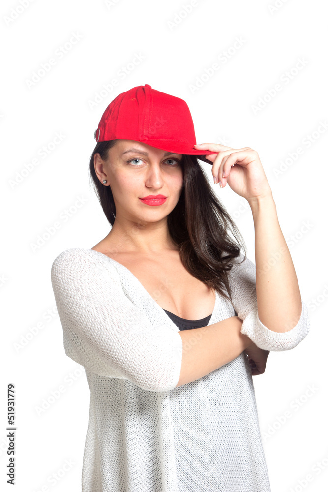 Attractive young woman wearing a red baseball cap Attractive young woman wearing a red baseball cap