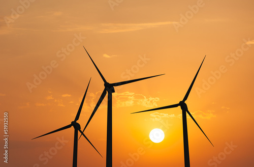 Wind generator turbines in sky photo