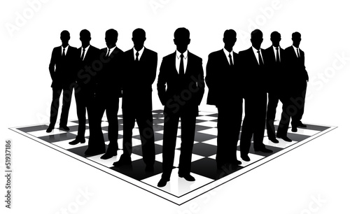 silhouettes of businessmen on a chessboard
