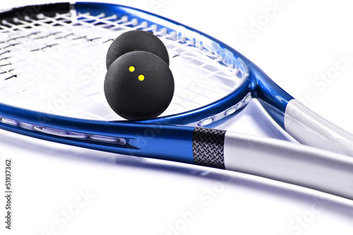 Blue and silver squash racket and balls photo