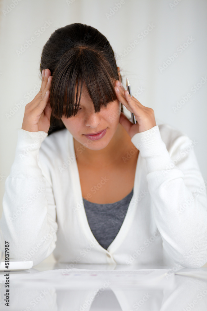 Reflective charming young woman working at office Reflective charming young woman working at office