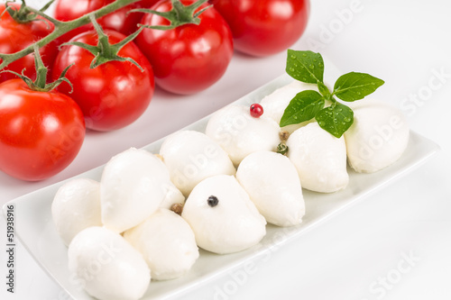 Mozzarella, tomatoes and basil leaves